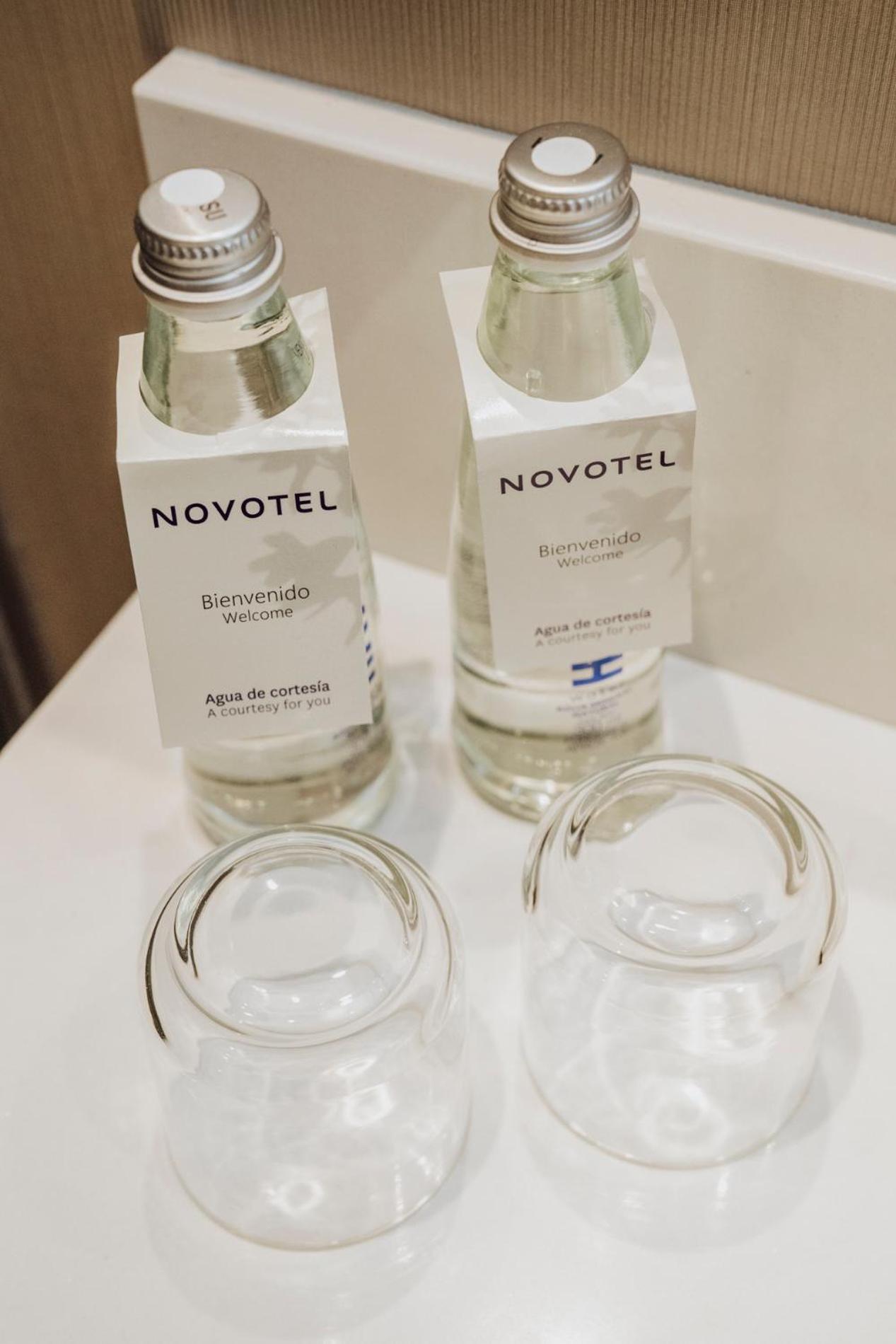 Novotel Medellin El Tesoro Eksteriør bilde Bottled water in a hotel room